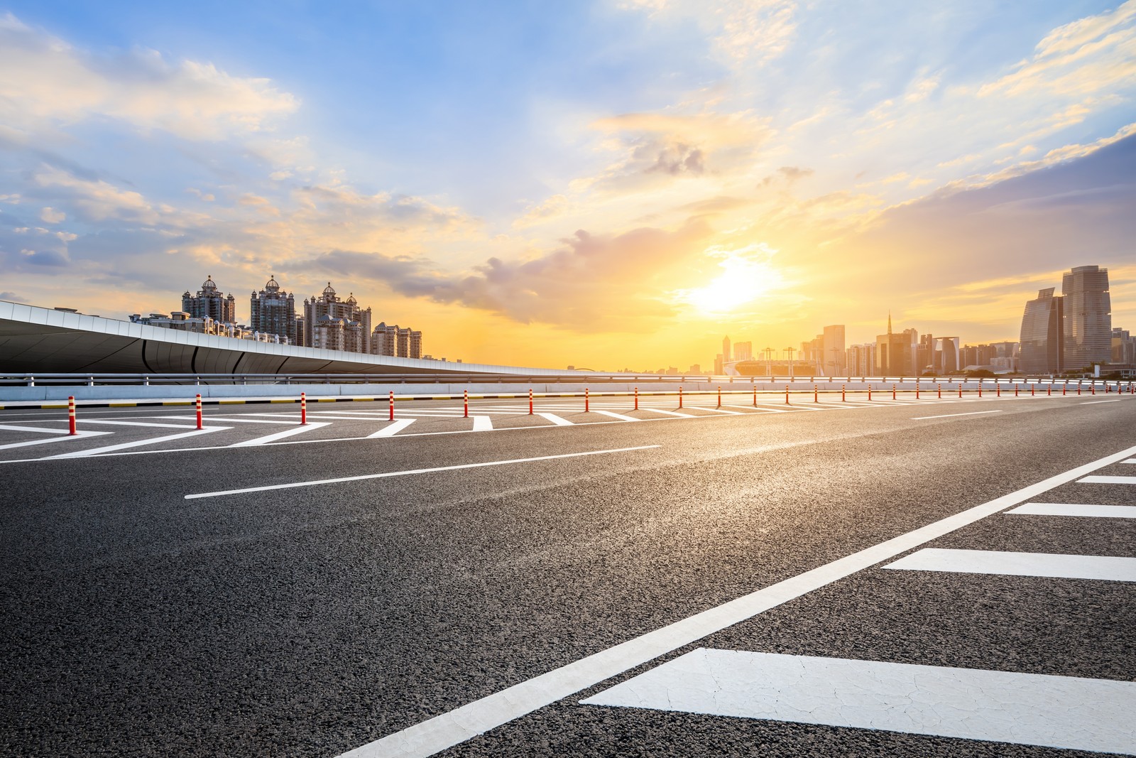 asphalt,highway,road,and,city,skyline,with,modern,buildings,at